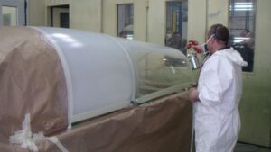 Applying Protectapeel spray on protective coating to an aircraft canopy