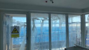 protective film losing adhesion exposing the glass and frames to damage