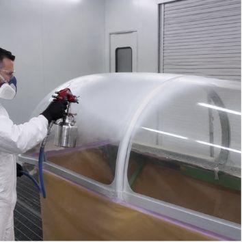 Spraying Protectapeel protective coating on an aircraft canopy