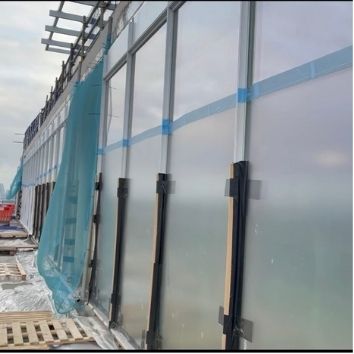 external glass panels coated with Protectapeel spray on glass protection during construction to prevent damage