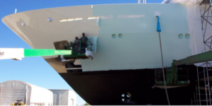 Peeling Protectapeel Boatshield by crane from a yacht in a storage facility 